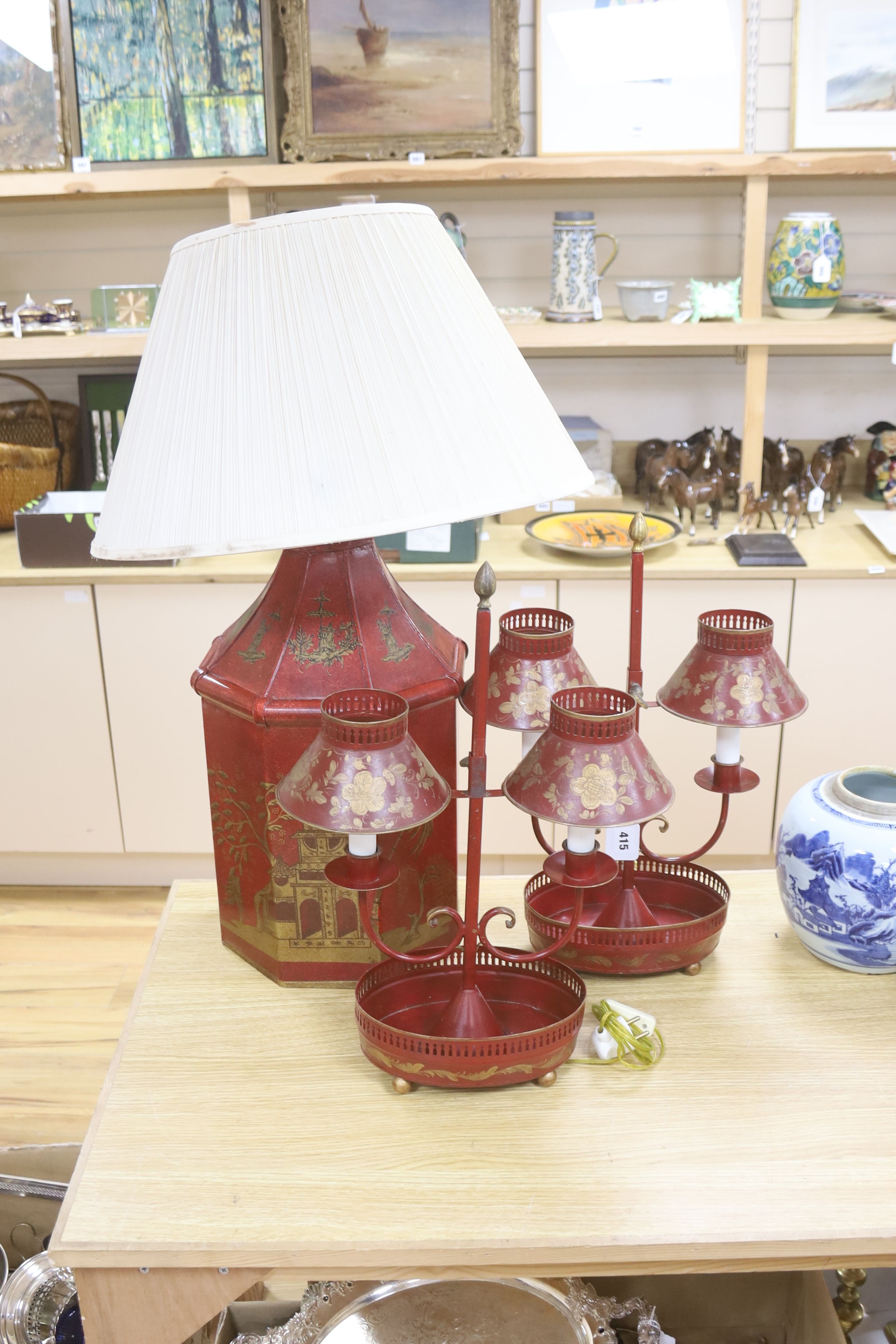 A pair of toleware student's lamps and one other, height 52cm excl. light fitting